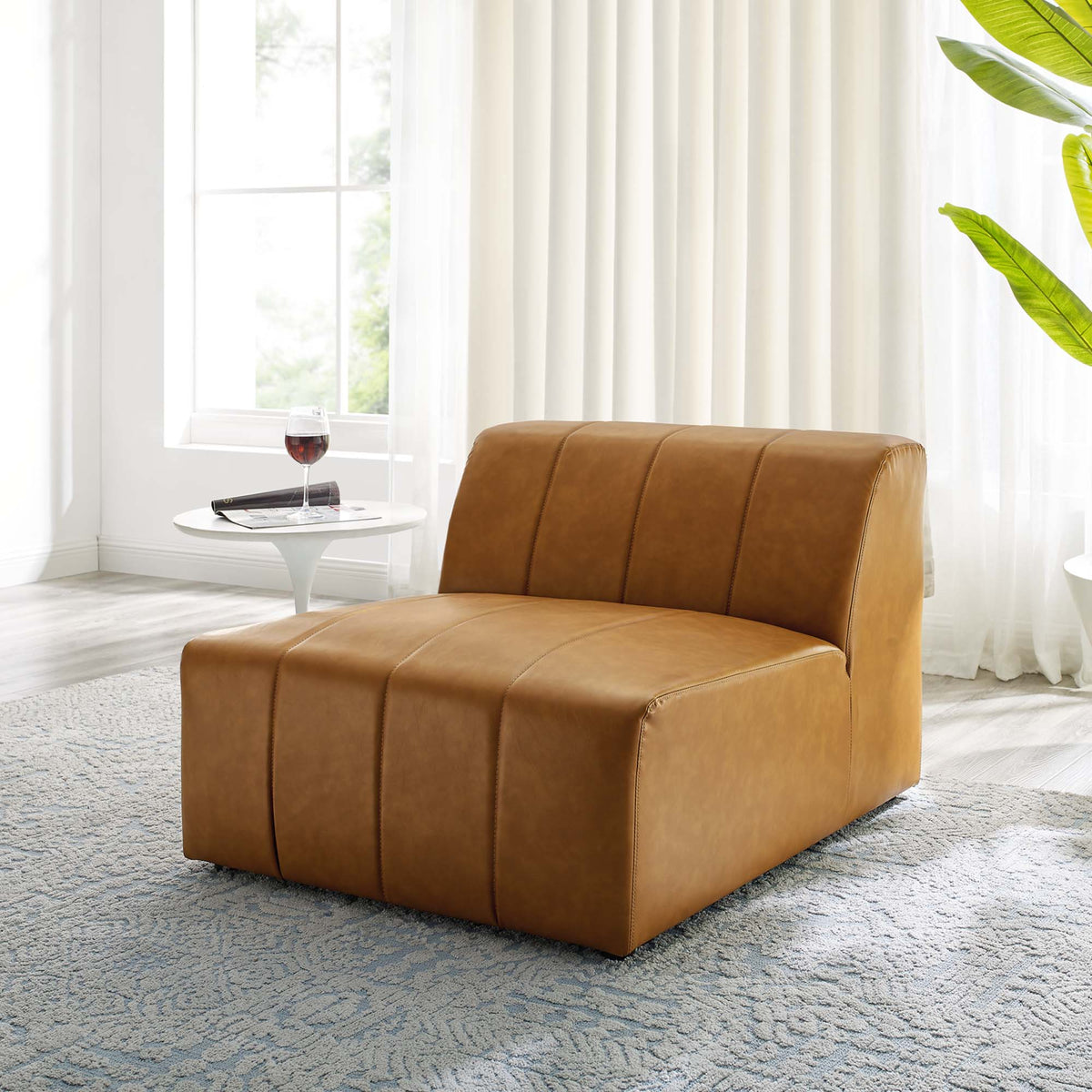 Bartlett vegan leather armless chair by Modway in caramel tan in a bright living room on Tampa Home & Garden Store