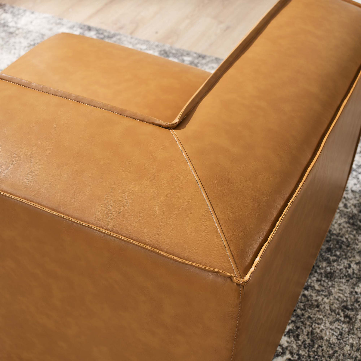 Restore vegan leather corner chair cushion in tan with visible stitching and seam details on Tampa Home & Garden Store