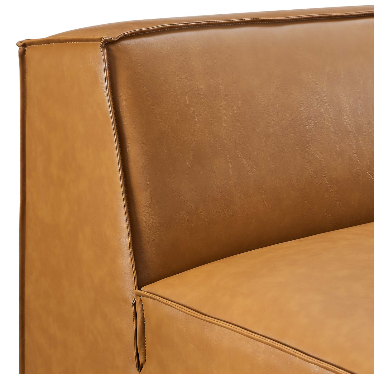 Armless vegan leather chair in tan with top-stitch seams and panel detailing on Tampa Home & Garden Store