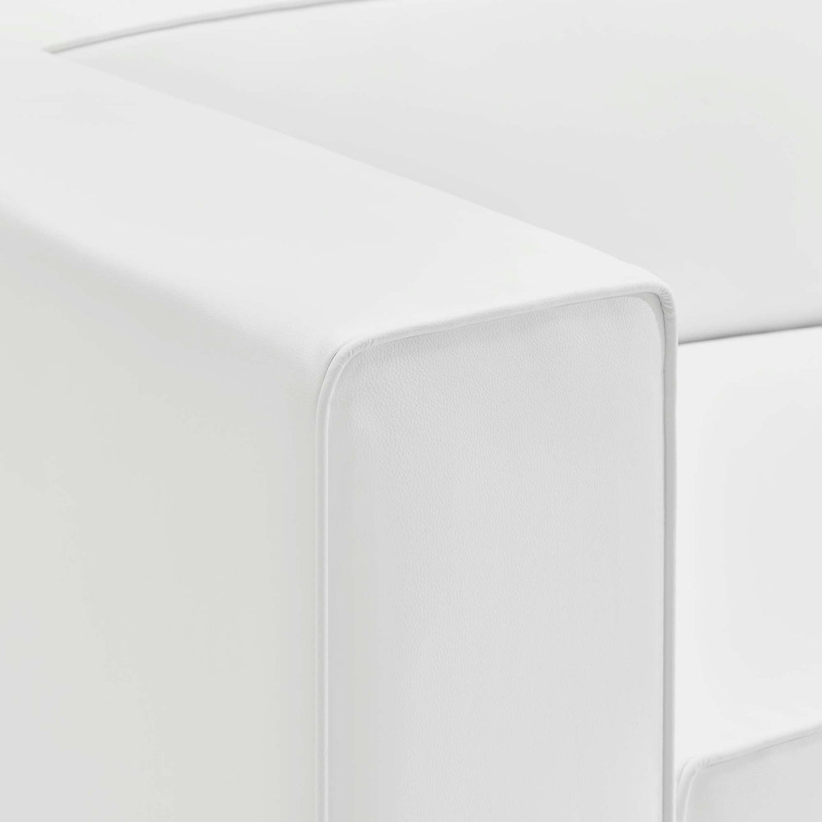 Mingle vegan leather right-arm chair close-up in white upholstery with visible stitching on Tampa Home & Garden Store