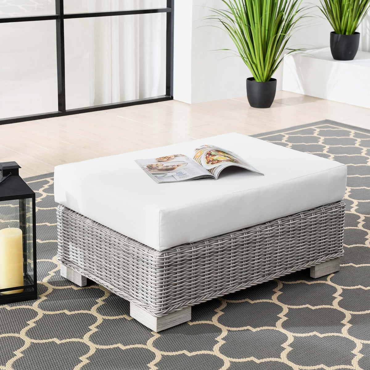 Conway outdoor wicker ottoman with white cushion and gray base in a patio setting by Modway on Tampa Home & Garden Store