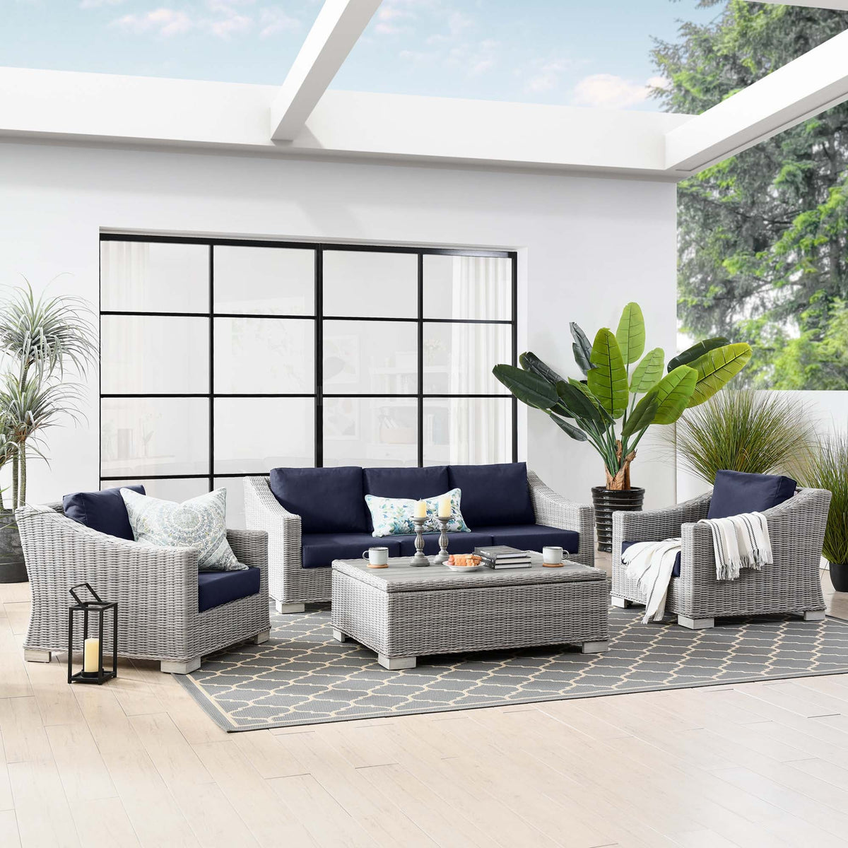 Conway 4-Piece outdoor wicker rattan furniture set navy cushions sofa chairs coffee table on Tampa Home & Garden Store