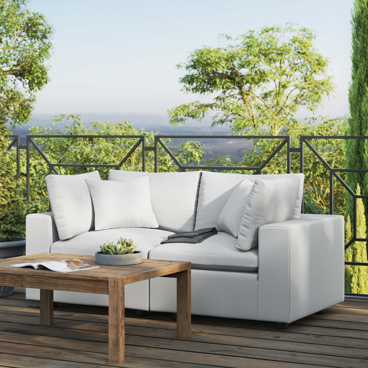 Commix overstuffed outdoor loveseat with light gray cushions and black metal frame on Tampa Home & Garden Store