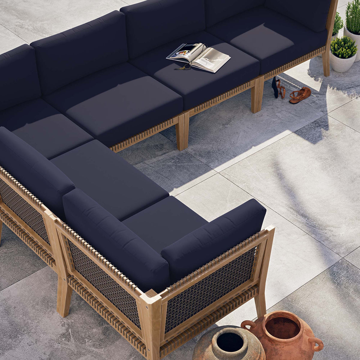 Clearwater 6-Piece Outdoor Teak Wood Sectional Sofa with navy cushions and woven panels on patio on Tampa Home & Garden Store