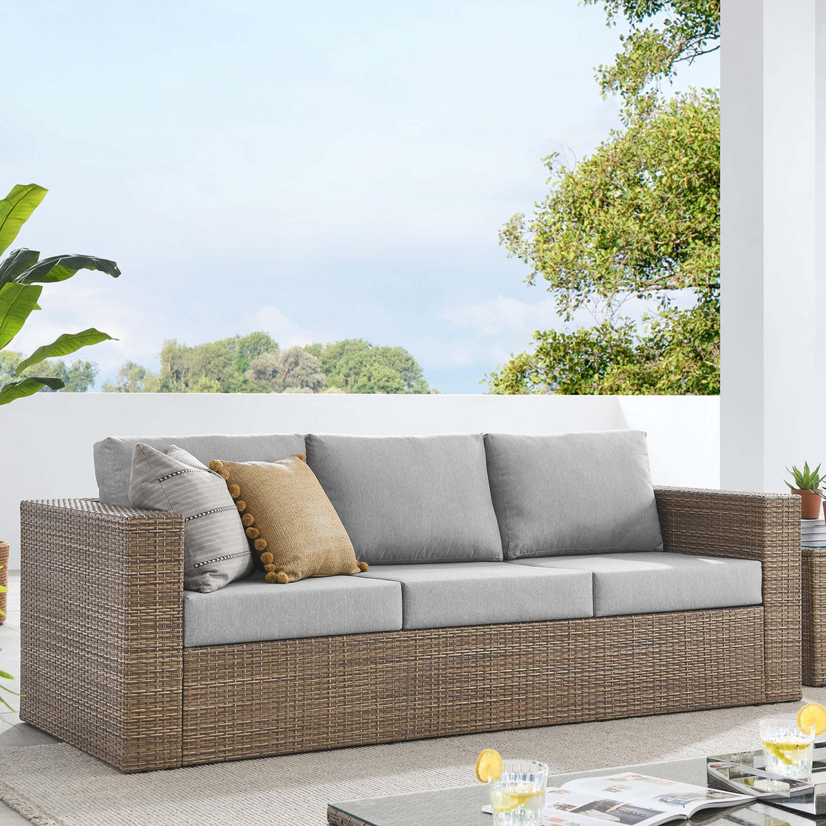 Convene outdoor patio sofa by Modway with gray cushions and brown wicker frame on a patio on Tampa Home & Garden Store