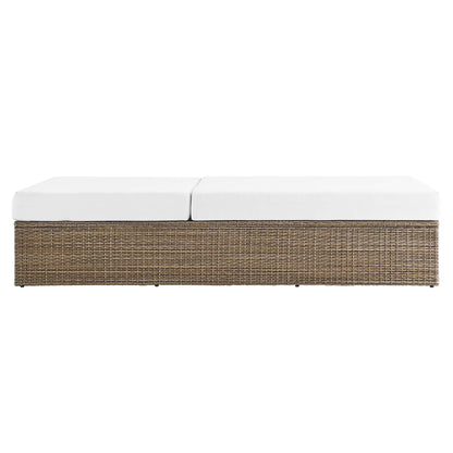 Convene outdoor patio chaise lounge chair with white cushions atop a brown wicker base on Tampa Home & Garden Store