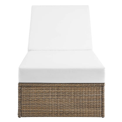 Convene outdoor chaise lounge chair with white cushion atop a woven wicker base on Tampa Home & Garden Store