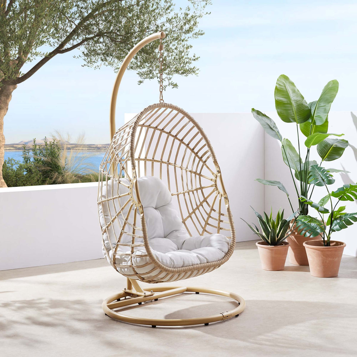 Amalie wicker rattan outdoor swing chair by Modway with beige cushions and round base stand on Tampa Home & Garden Store