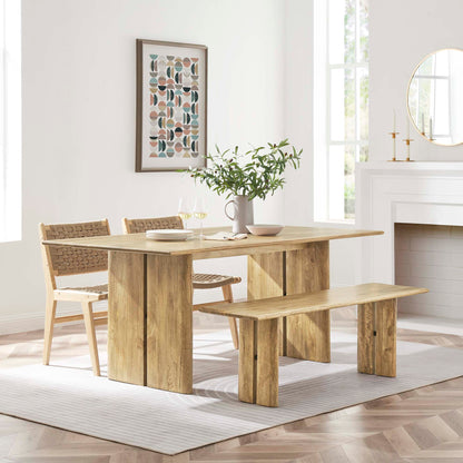 Amistad wood dining table with bench and woven chairs in natural oak finish bright dining room on Tampa Home & Garden Store
