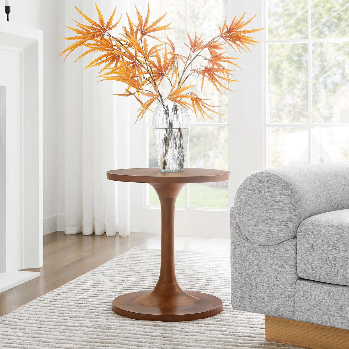 Lina round wood side table by Modway, warm brown finish with a glass vase and orange leaves on Tampa Home & Garden Store
