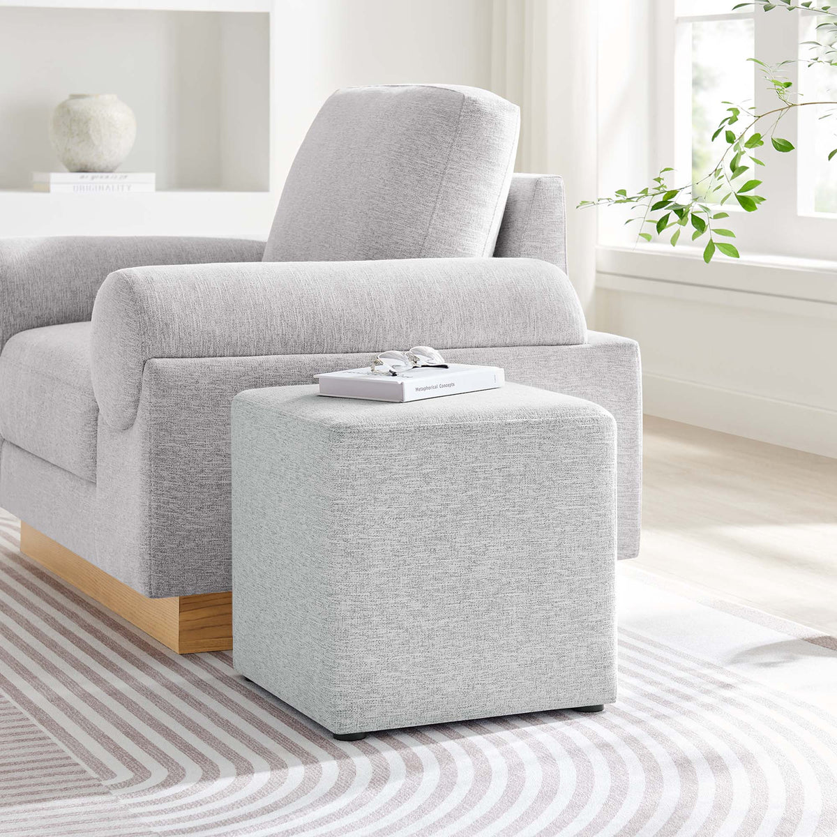 Callum 17-inch square woven heathered fabric upholstered ottoman in light gray with a wood base on Tampa Home & Garden Store