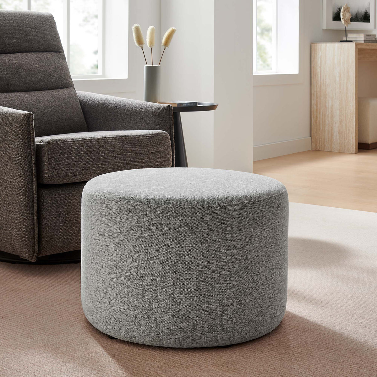 Callum large round woven heathered fabric ottoman with light gray upholstery on Tampa Home & Garden Store