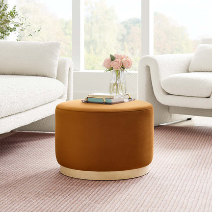 Tilden large round performance velvet upholstered ottoman by HouseOfZazla in warm rust brown velvet with a light wood base, between white boucle chairs on Tampa Home & Garden Store