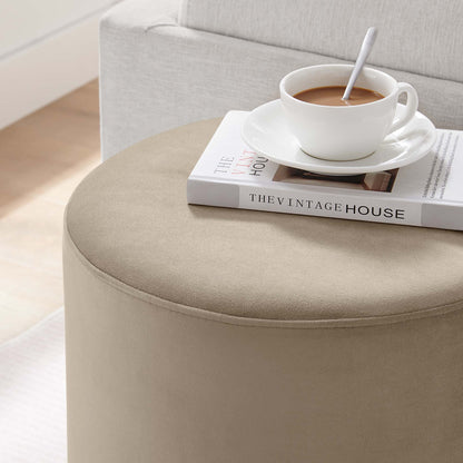 Round beige velvet ottoman Tilden 16in by Modway; seam detail with a coffee cup atop a book on Tampa Home & Garden Store