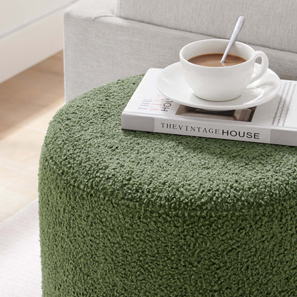 Tilden 16in round sherpa ottoman in green fabric; white coffee cup atop a magazine on Tampa Home & Garden Store