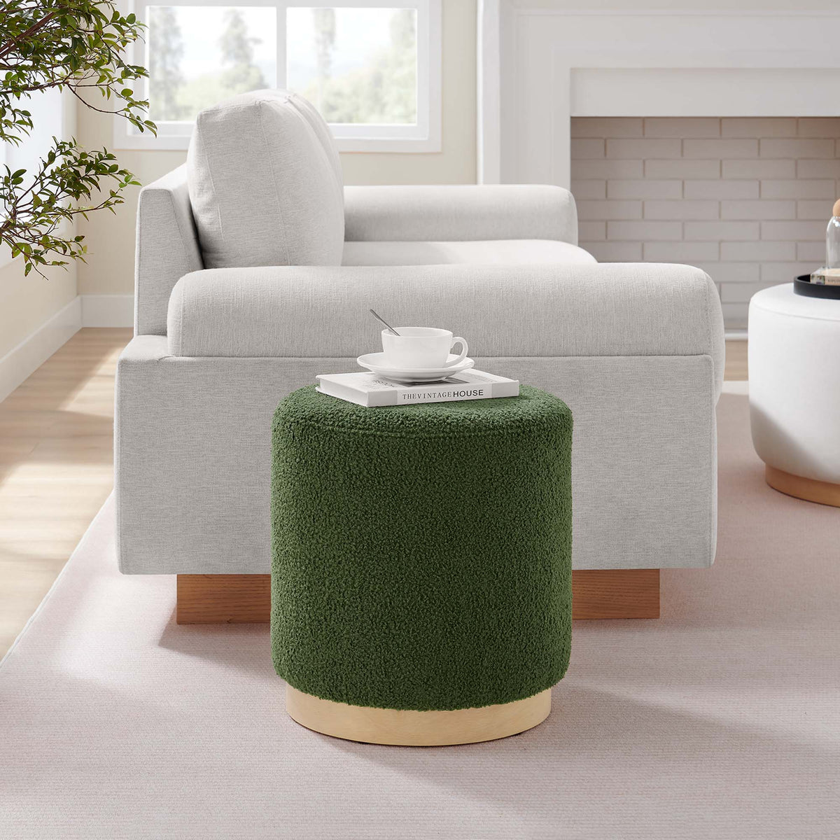 Modway Tilden 16in round sherpa upholstered ottoman in green shag placed in a bright living room on Tampa Home & Garden Store