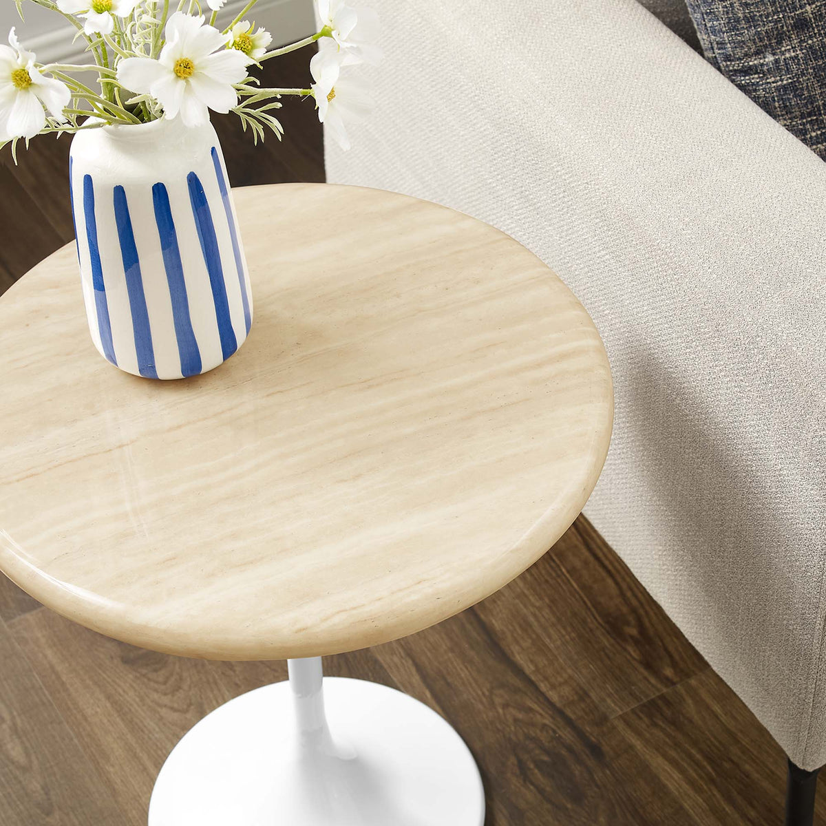 Lippa Round Faux Travertine Side Table with white pedestal base and blue striped vase on Tampa Home & Garden Store