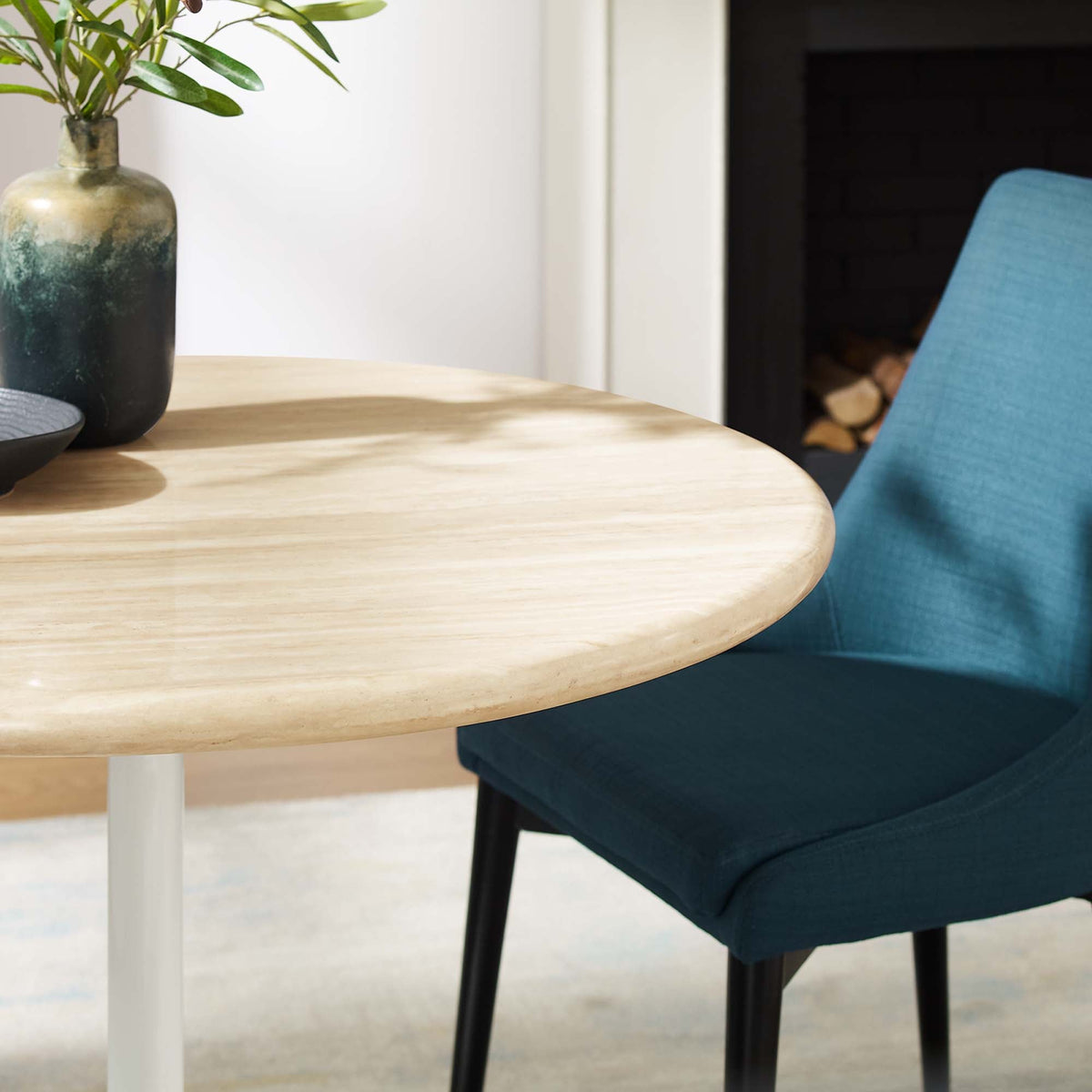 Lippa Round Faux Travertine Dining Table by Modway, light wood top with blue chair on Tampa Home & Garden Store