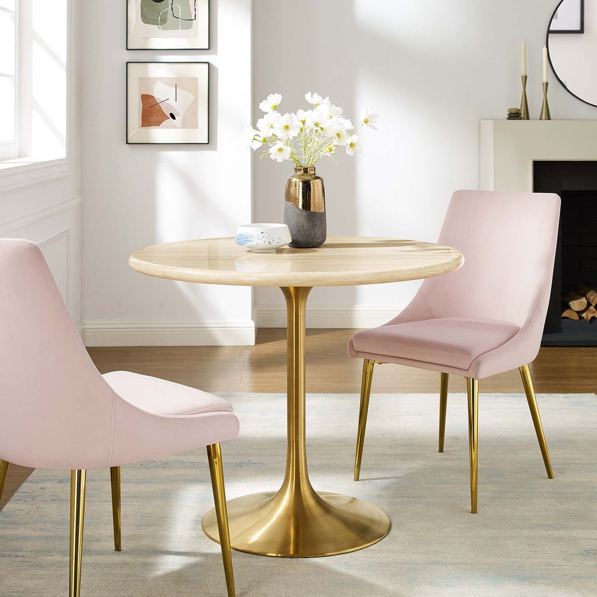 Lippa round faux travertine dining table with gold pedestal base, pink upholstered chairs on Tampa Home & Garden Store