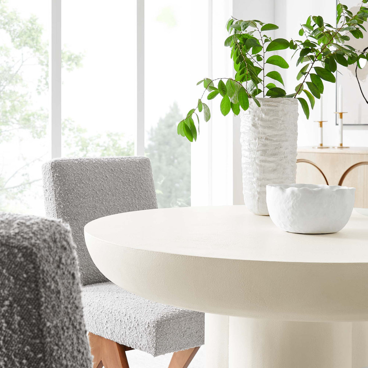 Modway Caspian 40in round concrete dining table in bright room with white planter and plant on Tampa Home & Garden Store