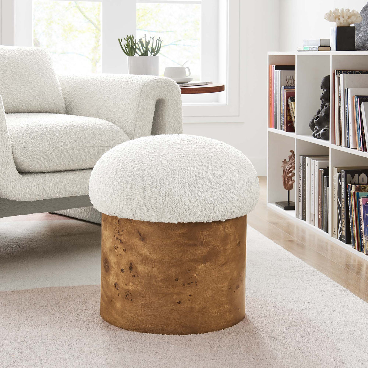 Breeze Boucle Upholstered Ottoman in off-white boucle with wood base in a cozy living room on Tampa Home & Garden Store