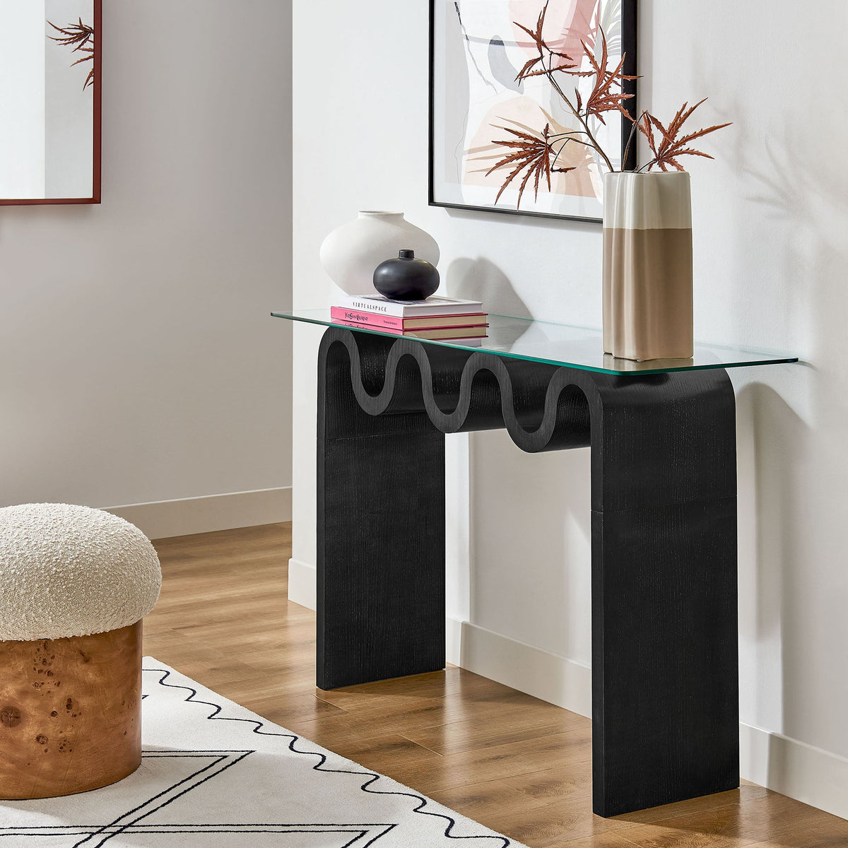 Ondine glass-top 50in console table with black sculpted base in a modern living space on Tampa Home & Garden Store