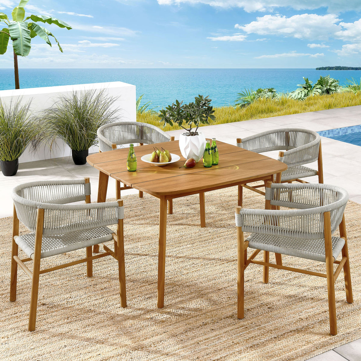 Vienna 5-Piece outdoor teak and rope dining set with curved-back armchairs on a seaside patio on Tampa Home & Garden Store
