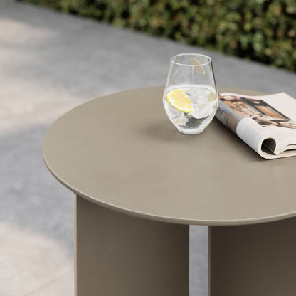 Tecton outdoor aluminum side table round taupe surface with lemon glass and magazine outdoors on Tampa Home & Garden Store