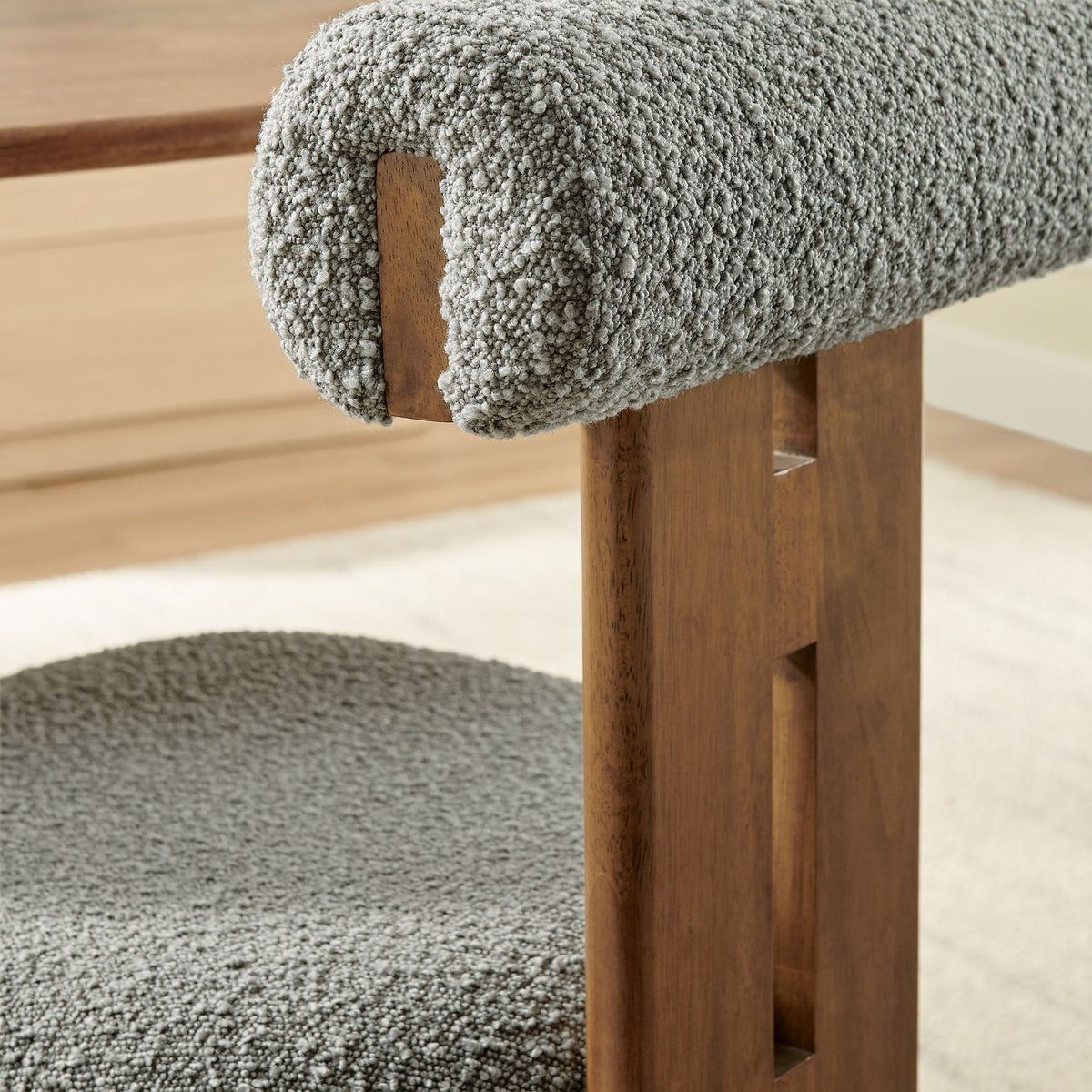 Torian Boucle Fabric Dining Chair close-up in gray boucle fabric with wooden legs on Tampa Home & Garden Store