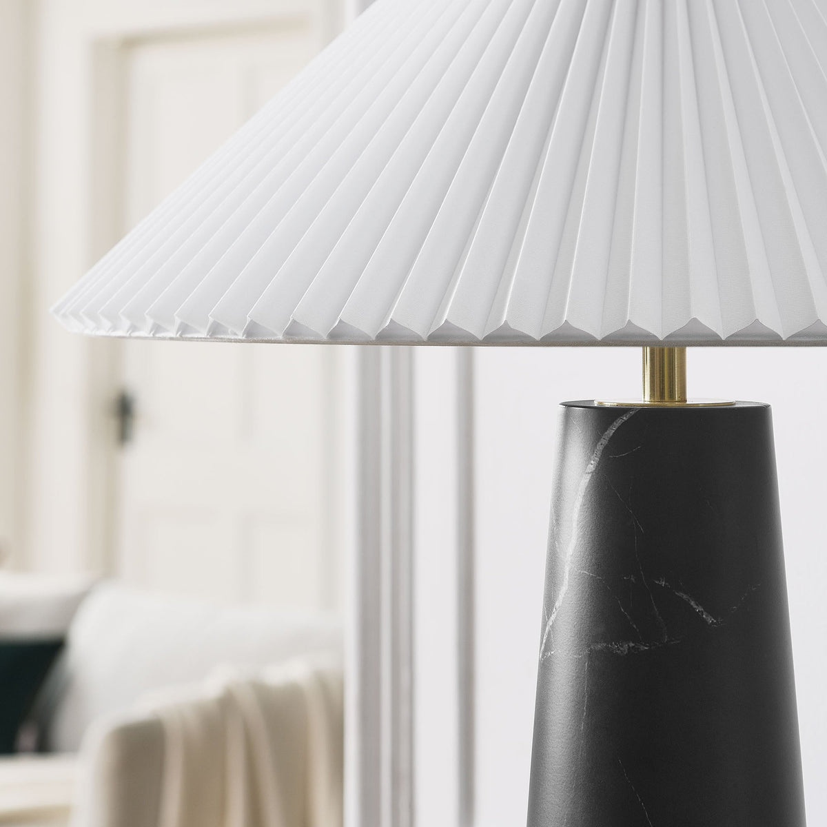 Nera Marble Table Lamp with pleated white shade atop a black marble base on Tampa Home & Garden Store