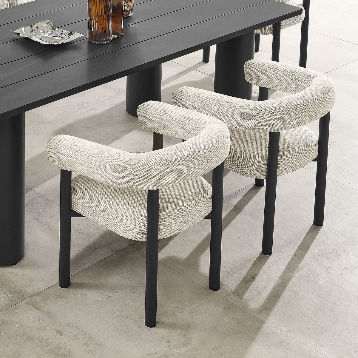 Nautica outdoor dining armchairs set of 2 with black aluminum frames and beige upholstery on Tampa Home & Garden Store