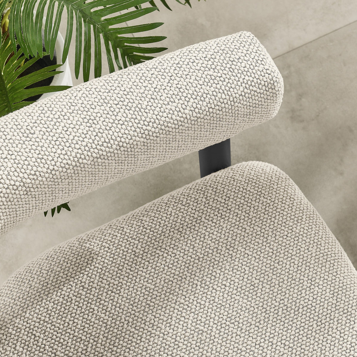 Nautica outdoor patio armchair beige woven upholstery close-up with tropical plant on Tampa Home & Garden Store