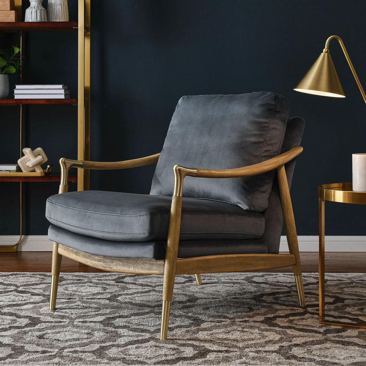 Langford Velvet Accent Armchair with gray upholstery and warm wood frame with brass accents on Tampa Home & Garden Store