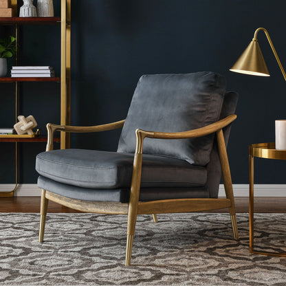 Langford Velvet Accent Armchair with gray upholstery and warm wood frame with brass accents on Tampa Home & Garden Store