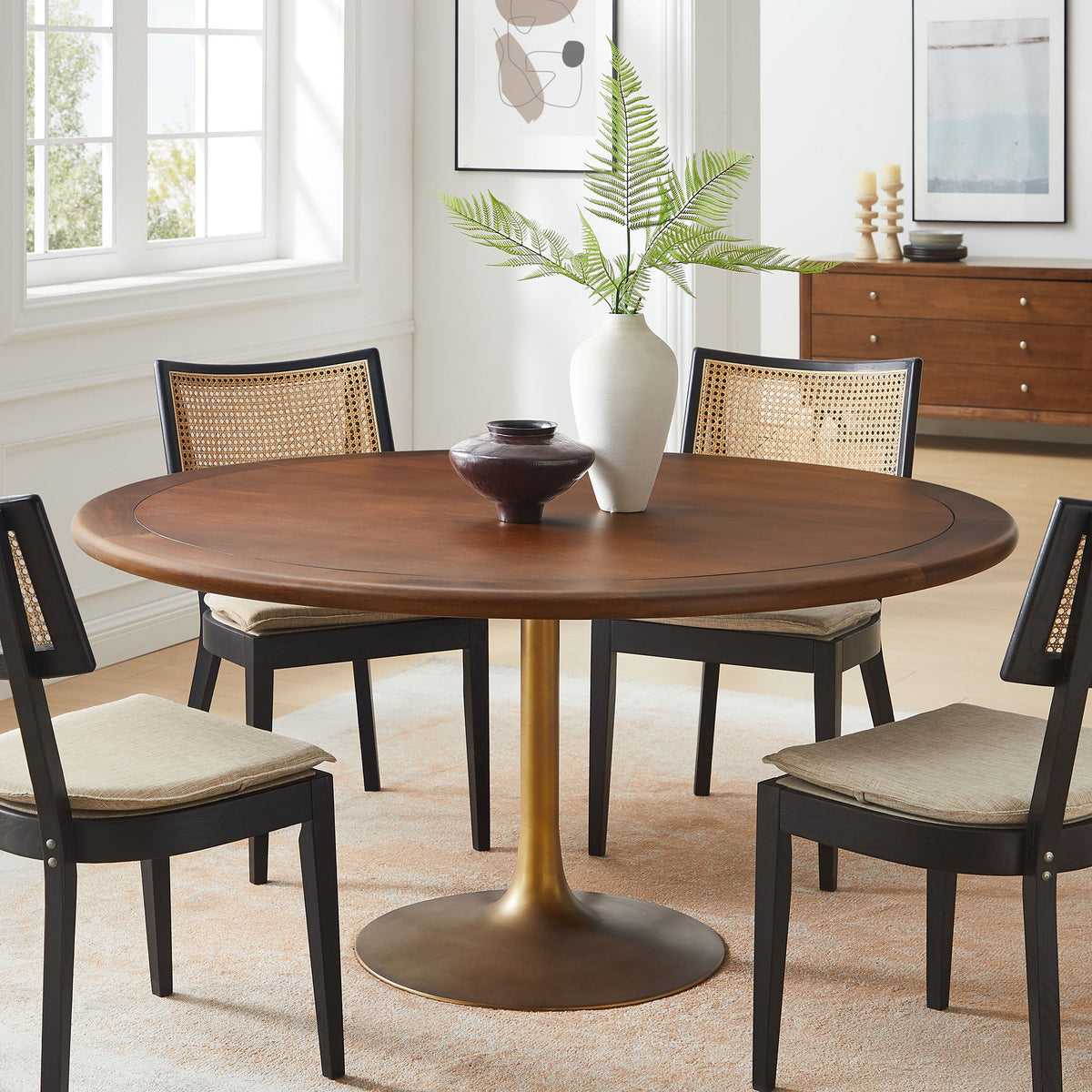 Lippa round pedestal dining table with warm wood top and black legs fern vase on Tampa Home & Garden Store