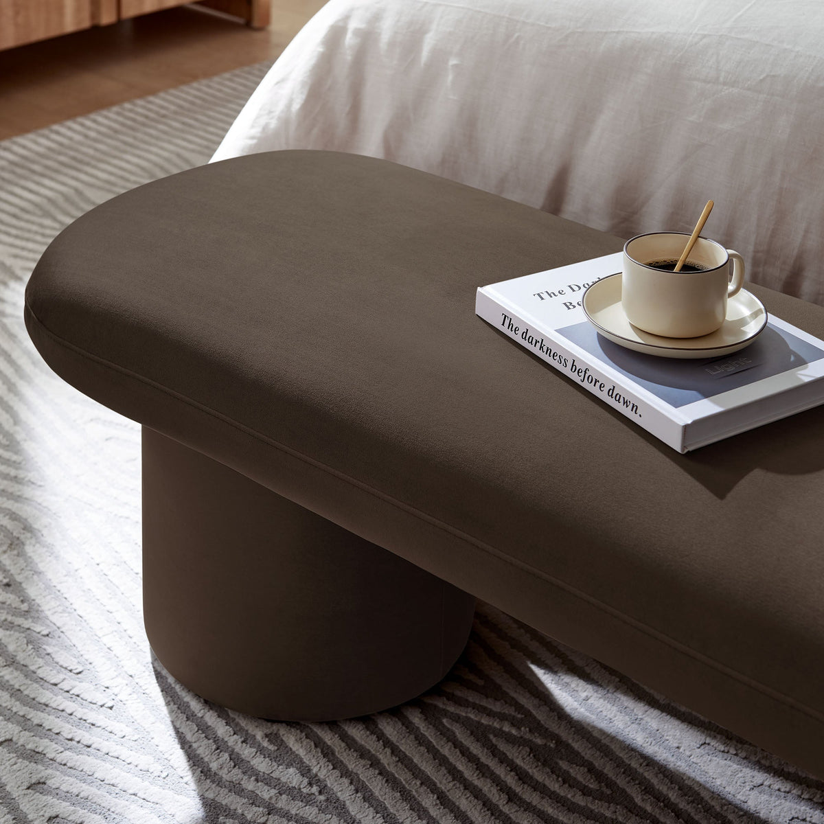 Orla Performance Velvet Bench brown velvet upholstery with coffee cup on a tray atop a book on Tampa Home & Garden Store