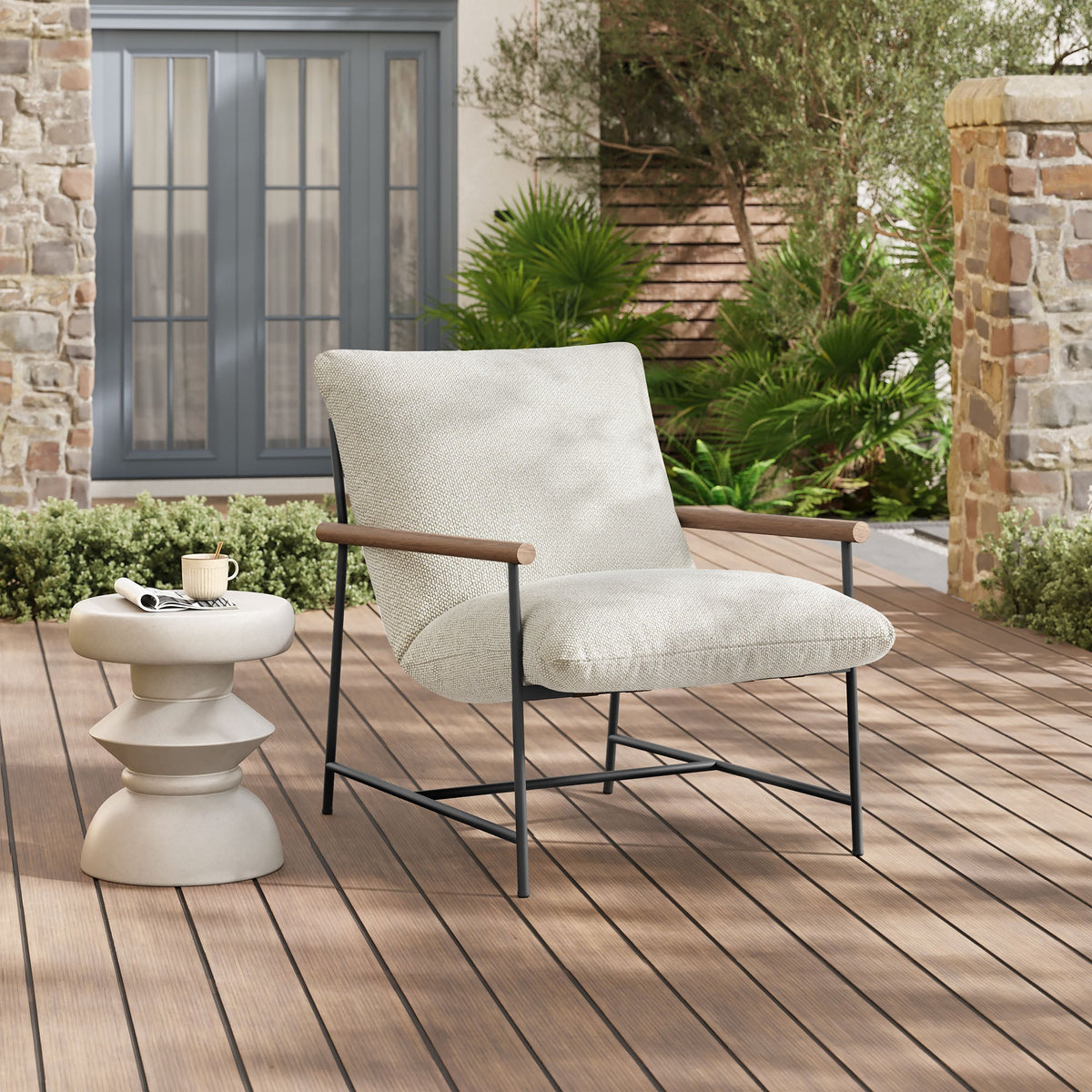 Raya outdoor boucle sling lounge chair beige textured fabric, wood armrests, dark metal frame on Tampa Home & Garden Store