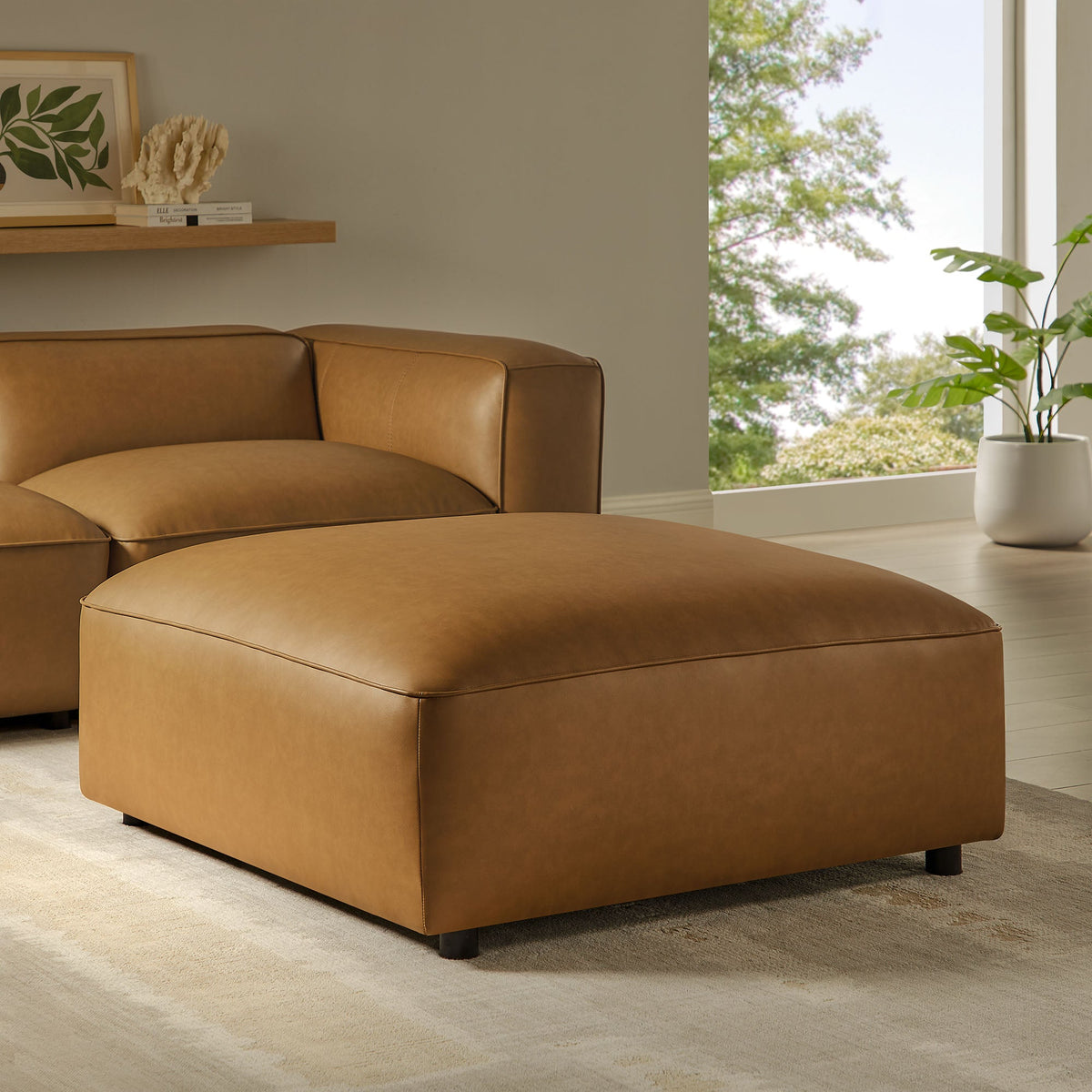Auren Upholstered Vegan Leather Ottoman in tan with stitched edges on Tampa Home & Garden Store