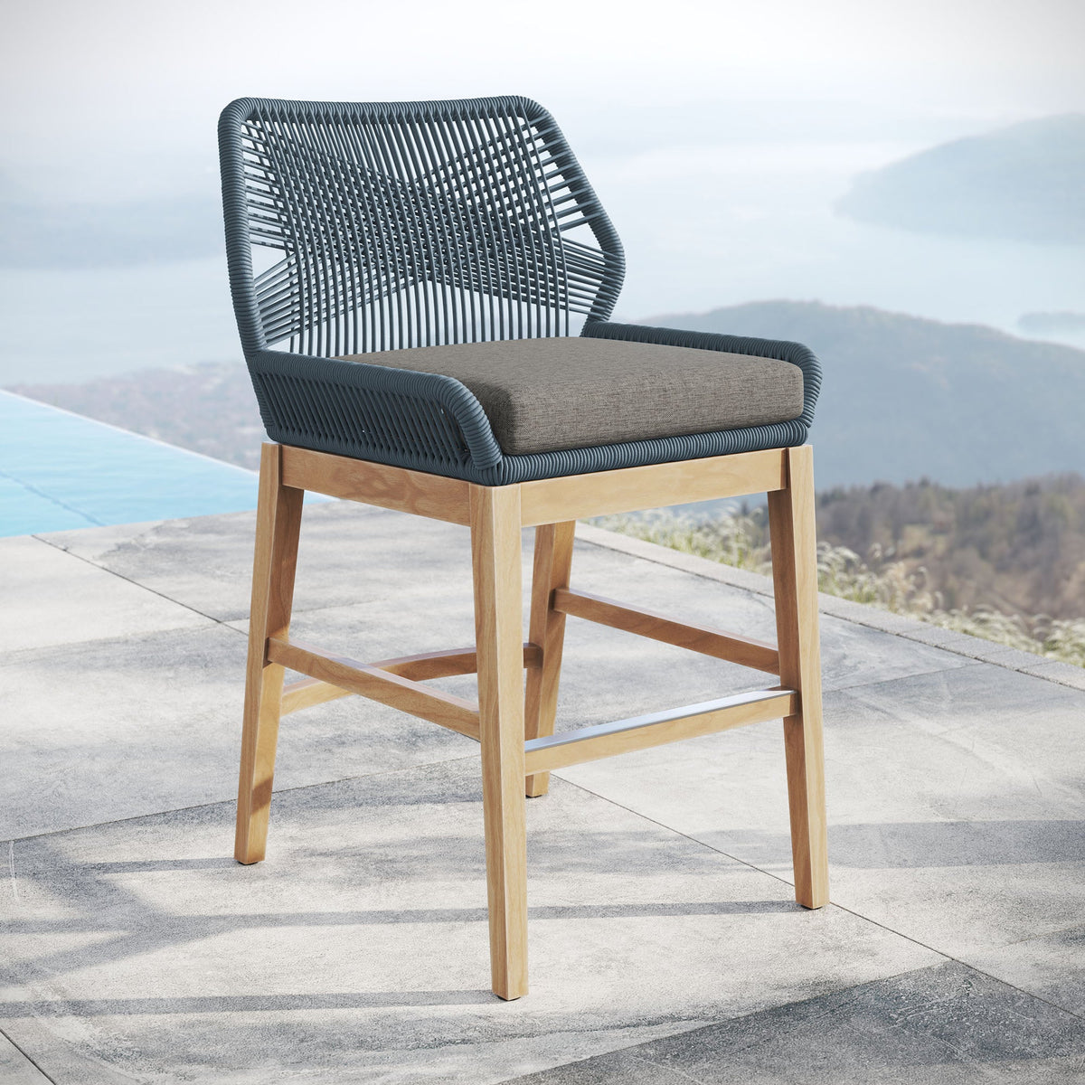 Wellspring teak rope counter stool with dark woven rope and beige cushion on natural wood legs on Tampa Home & Garden Store