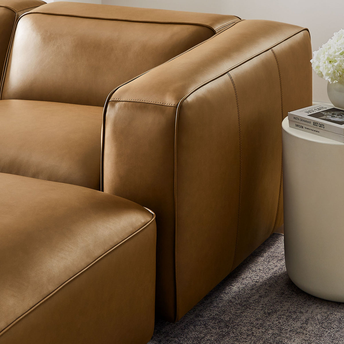 Auren tan vegan leather modular sofa arm close-up with stitched seams on Tampa Home & Garden Store
