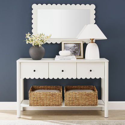 Emmeline 3-Drawer Scalloped Console Table in white with vase, lamp, and books on navy backdrop on Tampa Home & Garden Store