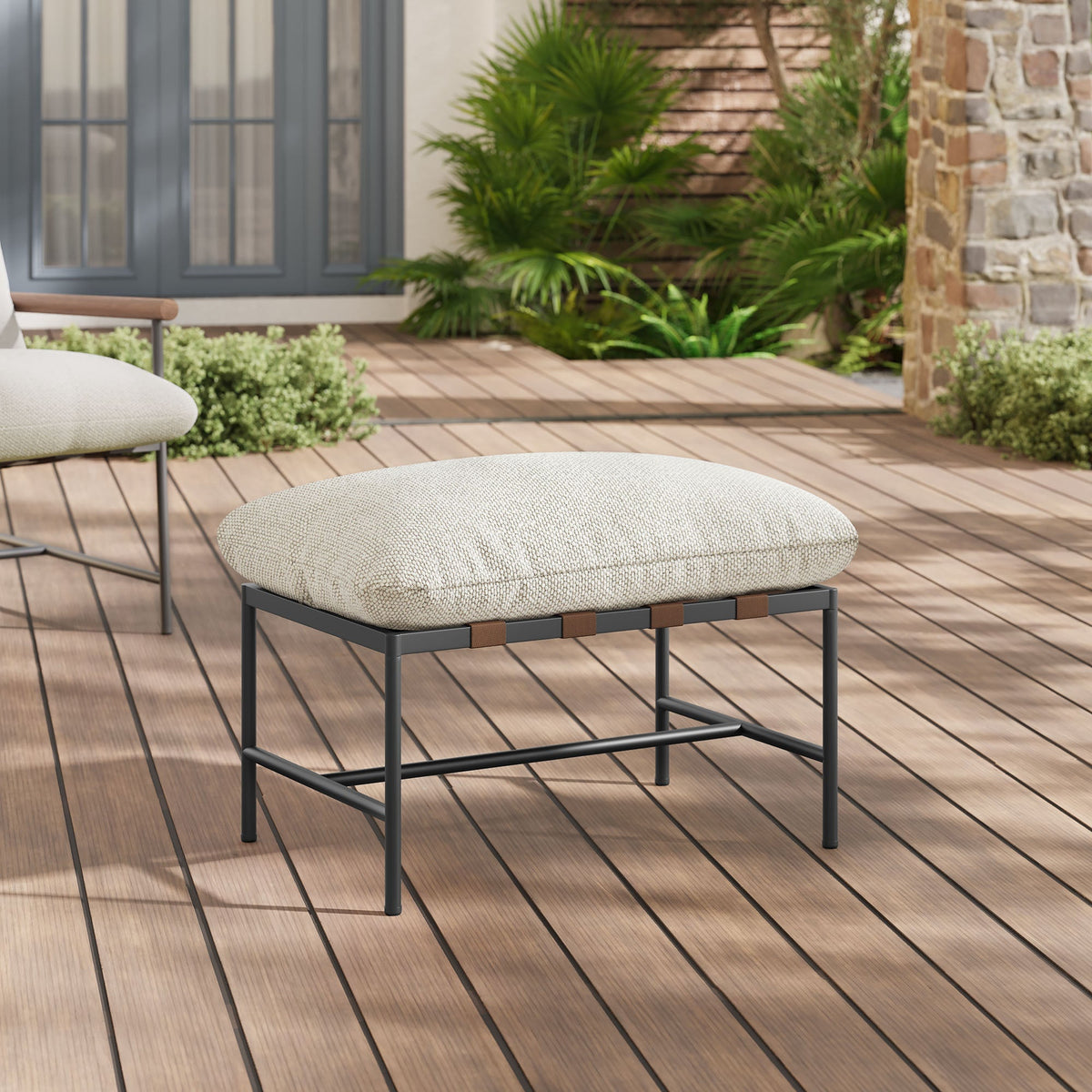 Raya Outdoor Patio Boucle Ottoman beige boucle fabric on dark metal frame atop a deck on Tampa Home & Garden Store