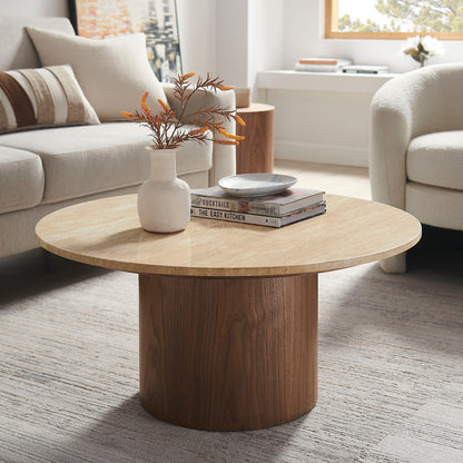 Kioni Round Travertine Coffee Table with wood base in a bright living room on Tampa Home & Garden Store