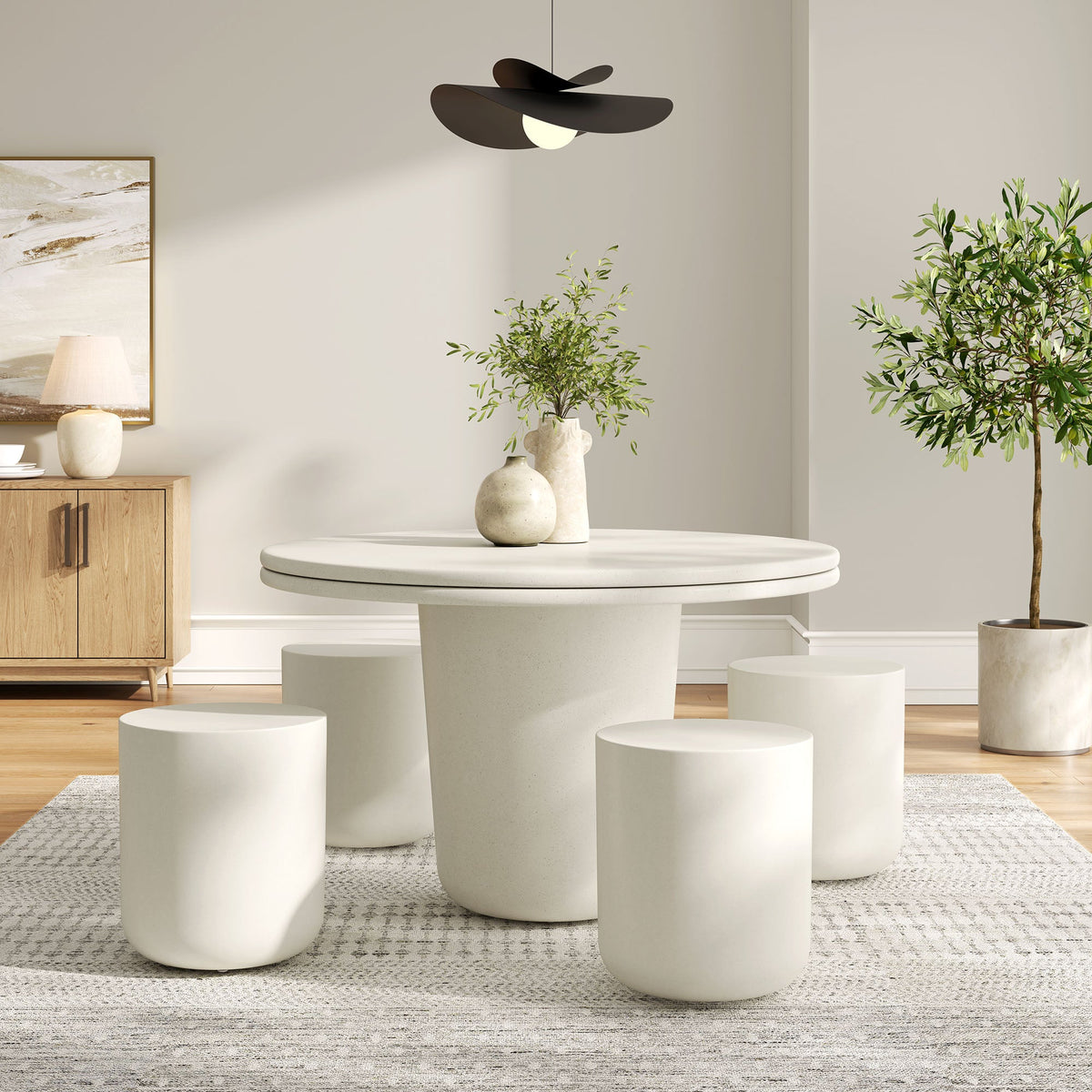 Brion concrete 5-piece dining set with round table and stools in a neutral interior on Tampa Home & Garden Store