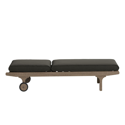 Saratoga outdoor teak chaise lounge with charcoal cushions on a wheeled wooden base on Tampa Home & Garden Store