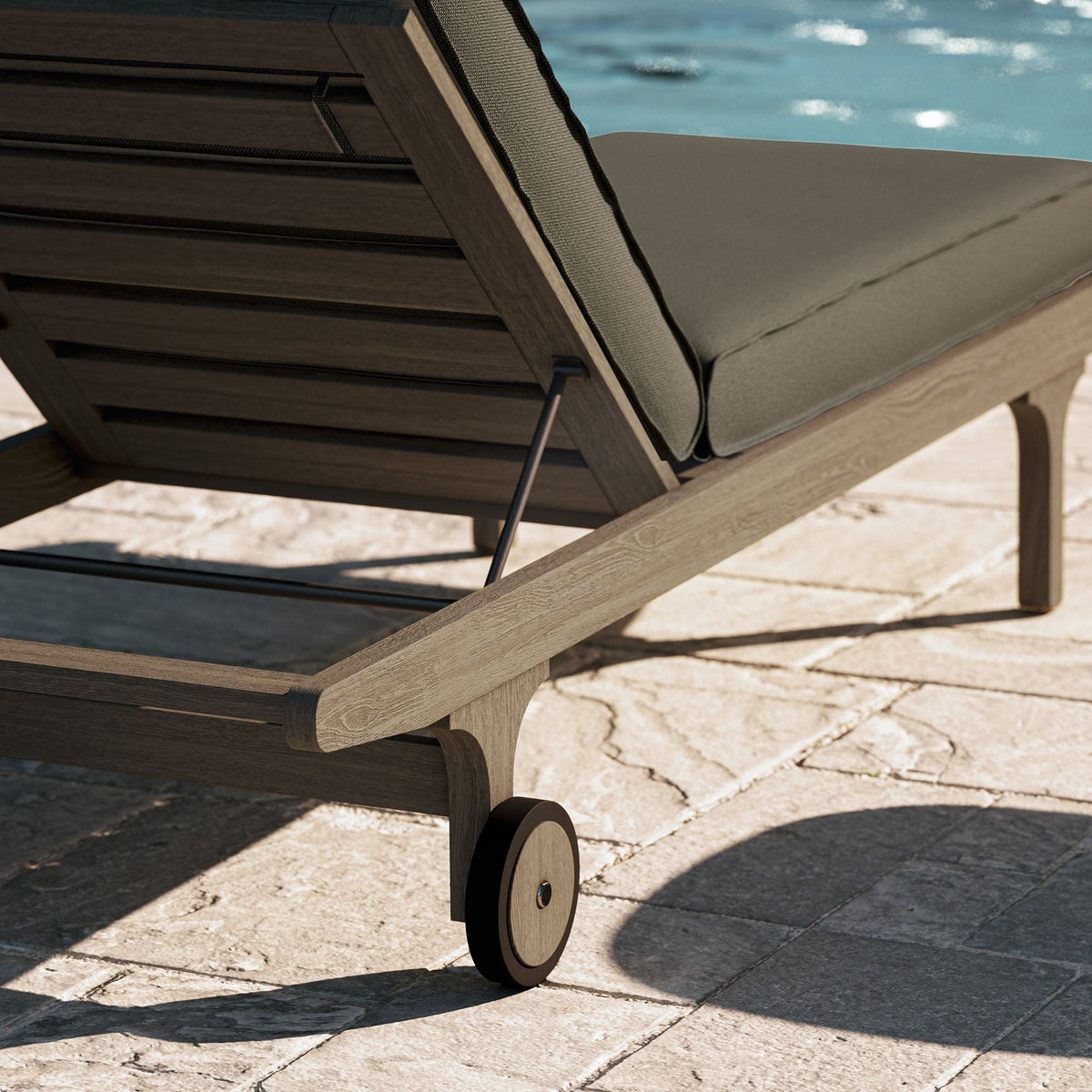 Saratoga teak chaise lounge chair with gray cushion on a wooden frame with wheels on Tampa Home & Garden Store