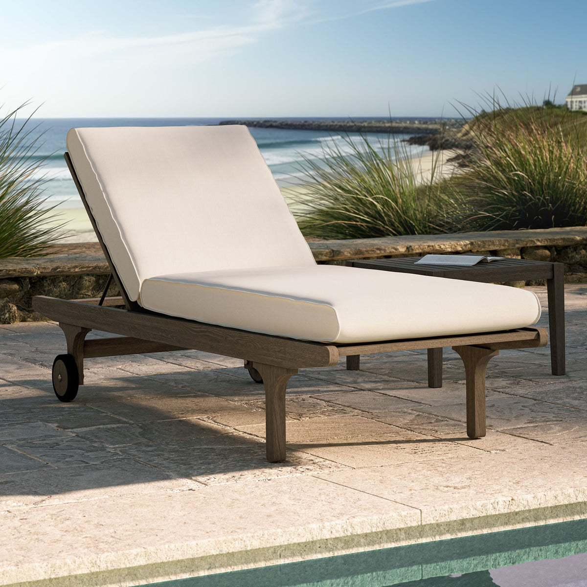 Saratoga outdoor teak chaise lounge chair with beige cushion on a wooden frame with wheels on Tampa Home & Garden Store