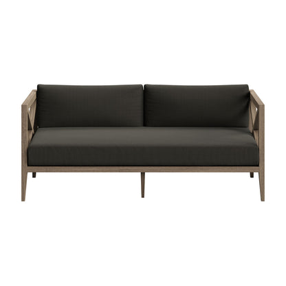 Northlake outdoor teak wood loveseat with dark charcoal cushions, teak frame and slim arms on Tampa Home & Garden Store