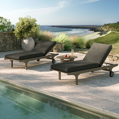Saratoga teak 3-piece chaise lounge set with black cushions and side table on coastal deck on Tampa Home & Garden Store