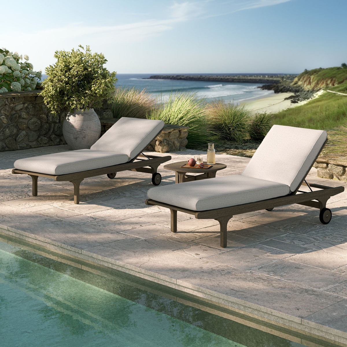 Saratoga teak wood 3-piece chaise lounge set with light gray cushions on a stone patio on Tampa Home & Garden Store